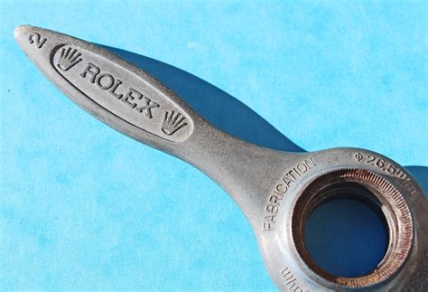 rolex watch opener tool.